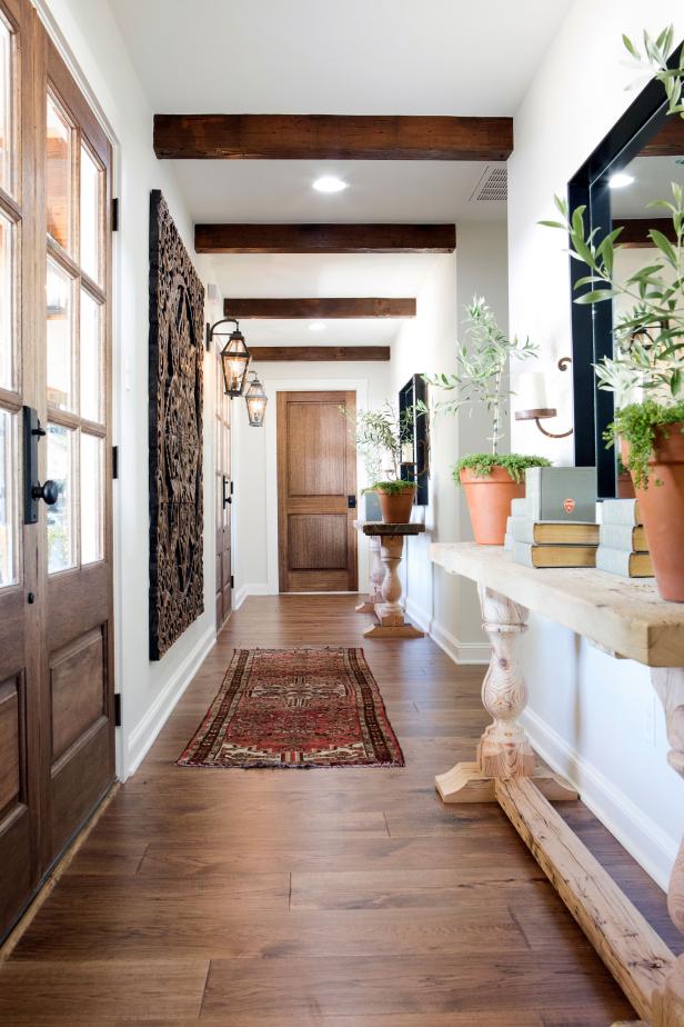Foyer With Custom Console Tables and Exposed Beam Ceiling