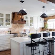 Open Plan Kitchen With Travertine Stone Backsplash and Wood Details 