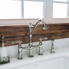 Kitchen Sink Area With Shiplap Panel Backsplash and Chrome Faucet