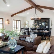 Open Concept Living Space With Exposed Beam Vaulted Ceiling