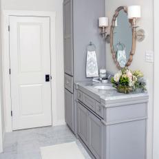 Remodeled Master Bathroom With Gray Vanity and Marble Countertops
