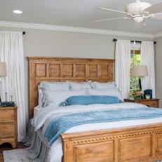 Renovated Master Bedroom With Gray Walls and Blue Accents