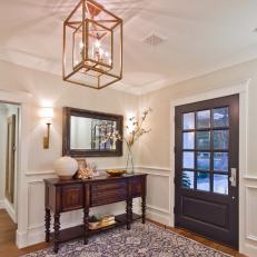 Beautiful Entryway With Wood Console, Wainscoting