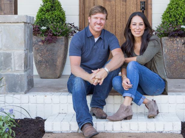 As seen on FIxer Upper, Chip and Joanna Gaines on the Ignacio's rennovated front porch. (Portrait)