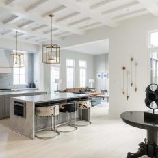 Open Concept Modern Kitchen With Cow Hide Barstools