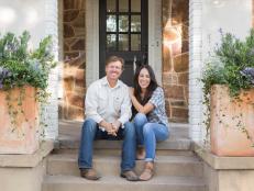 As seen on Fixer Upper, Chip and Joanna Gaines on the front porch of the remodeled Flip house. (Portrait)