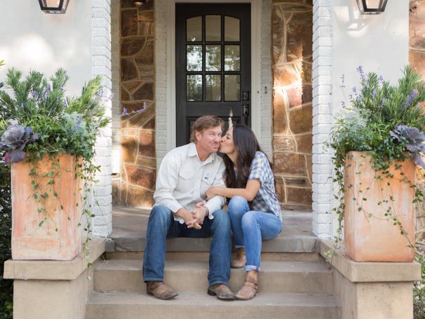 Chip and Joanna Gaines on the porch of the Flip House