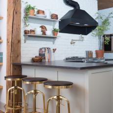 Eclectic, Black-and-White Kitchen With Painted Brick Walls