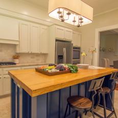 Blue Kitchen Island with Salvaged Wood Countertop