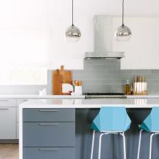 Gray and White Kitchen With Blue Barstools
