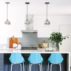 Gray and White Transitional Kitchen With Blue Barstools
