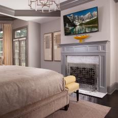 Gold and Silver Bedroom With Fireplace