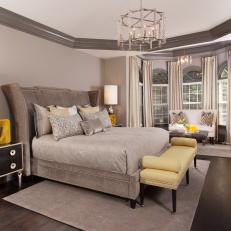 Neutral Transitional Master Bedroom With Yellow Bench