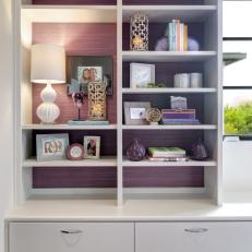 Purple and White Shelf With Lamp