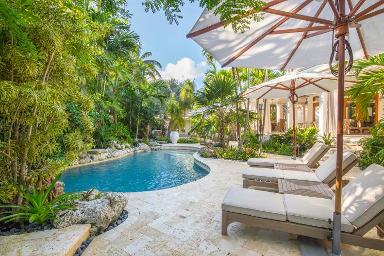 Tropical Backyard With Pool, Palm Trees, Lounge Chairs