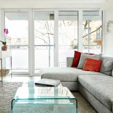 Bright and Airy Living Room With Gray Sectional