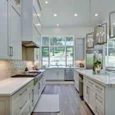 White Transitional Open Kitchen With Metal Pendants