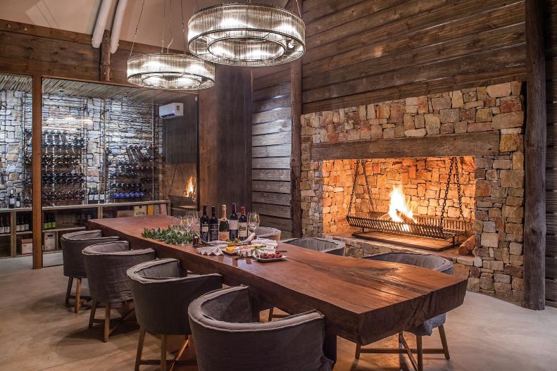 Rustic Dining Room With Fireplace, Wine Cellar