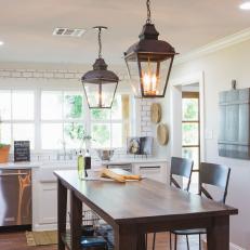Kitchen With Center Island and Light Fixtures