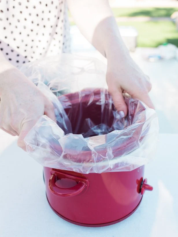 Step 1- Line the Pot
Placing a plastic liner inside the ceramic pot will keep this DIY project easy to clean up!