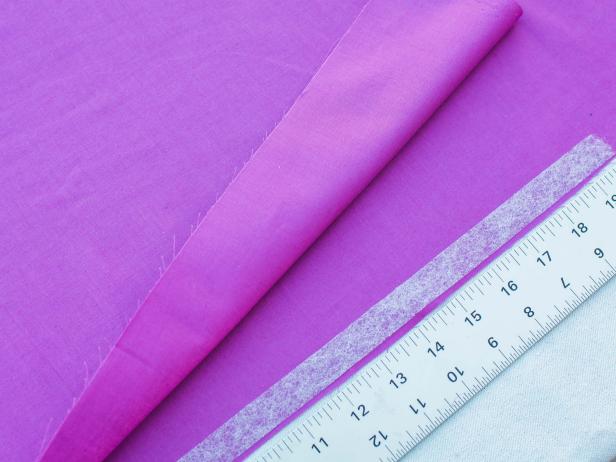 Step 5-  Add No Sew Tape 
Roll out the sewing adhesive tape along each edge, stopping just shy of the 20-inch mark.