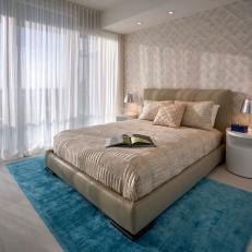 Neutral Contemporary Bedroom With Blue Rug