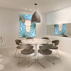 Modern Neutral Dining Room With Blue Art