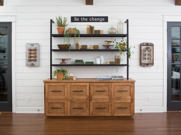 As seen on Fixer Upper, the main room of the Matsumoto's remodeled home has shiplap walls, wood floors and two sets of french doors that lead out to the back porch. (After #4)