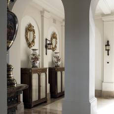 Foyer With Archways and Elegant Vases