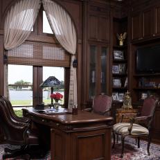 Traditional Home Office With Arched Window Wood Bookshelves