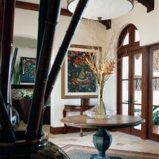 Bold Art and Rich Wood Warm Entryway