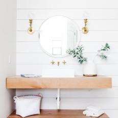 Golden Wood Shelves in White Master Bathroom