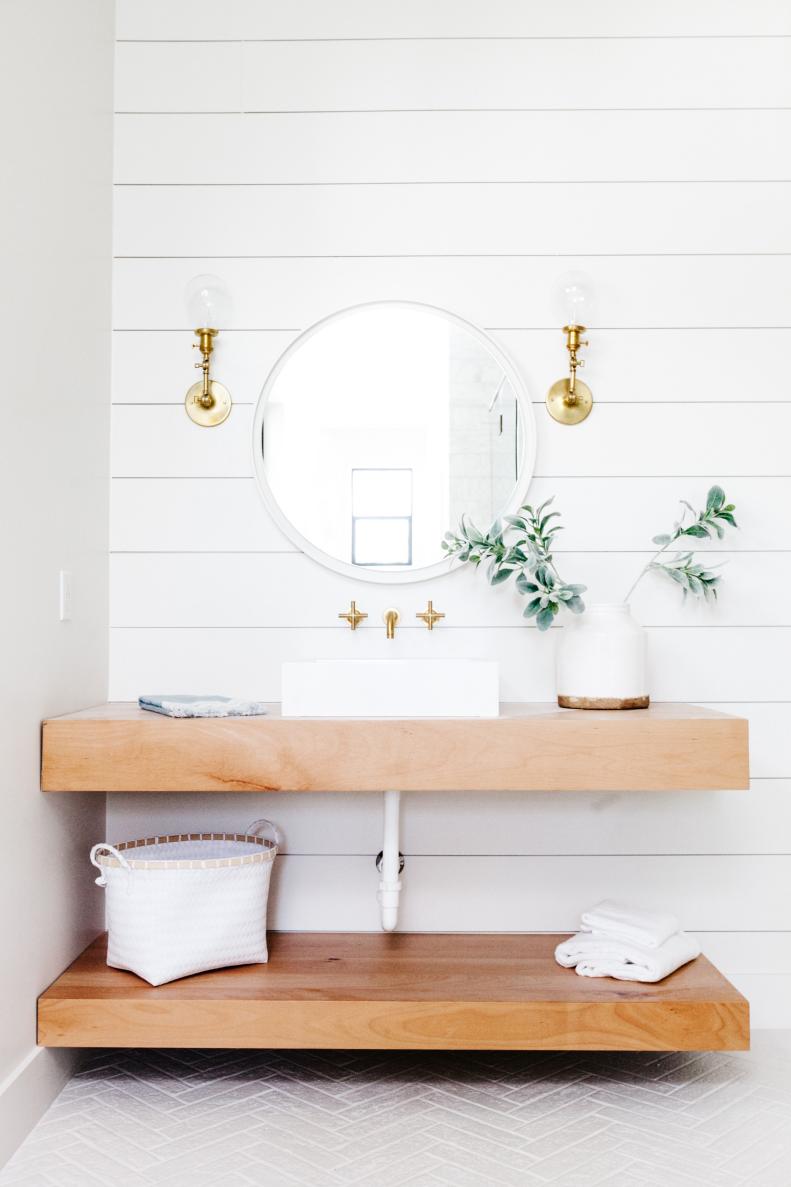 White Master Bathroom with Golden Wood Shelves