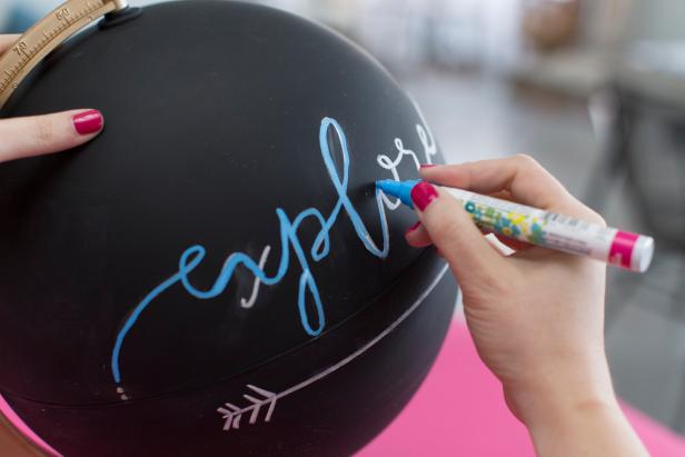 Writing Over Globe With Chalk Marker