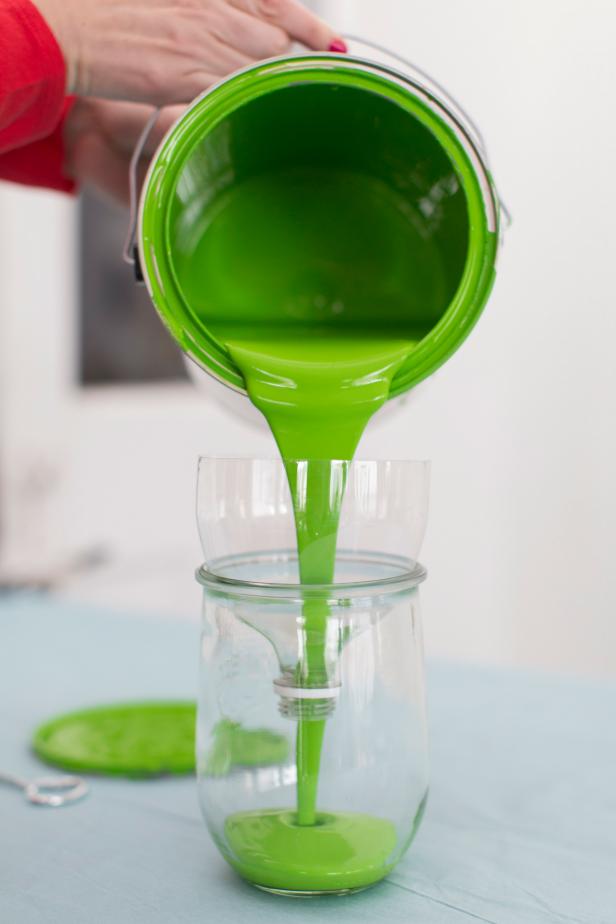 Pouring Leftover Paint Into Glass Jar