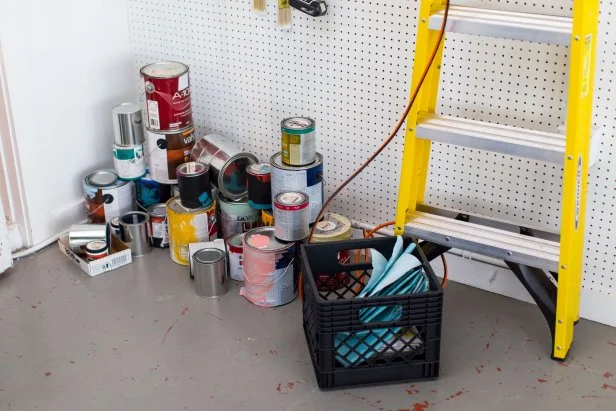 Leftover Paint Cans in Floor of Garage