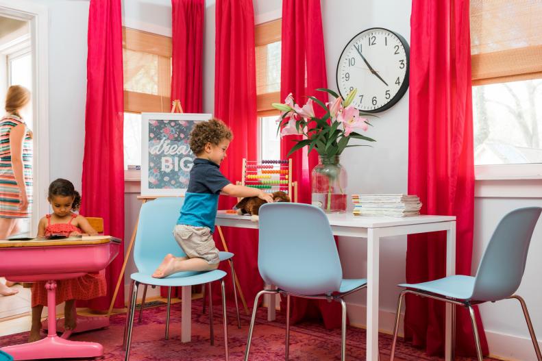 Create a work/play environment that's packed with plenty of storage, work surfaces and designated spots for kids and adults.