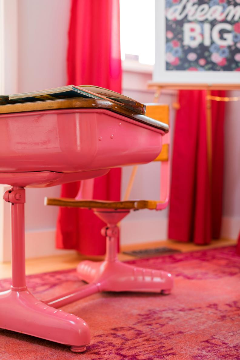 GIVE OLD DESK NEW LIFE
If you've got an existing piece of furniture perfectly fit for little ones but lacking in the style department, breathe new life into the piece with bold colored lacquer. This 1950s grade school desk was given a high-energy update with glossy hot pink lacquer applied with a high volume low pressure paint sprayer.