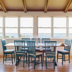 Dining Room With Blue Chairs and Wooden Table