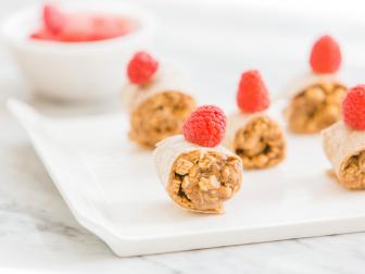 Packed with fiber, this whole-wheat wrap features a generous layer of almond butter sprinkled with granola. Top with a fresh raspberry for a cheery bit of color!