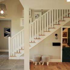 Contemporary Neutral Foyer with White Staircase