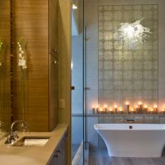Tile Accent Wall and Candles Create Focal Point in Master Bathroom