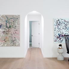 Abstract Art and Seating Vignette in Hallway