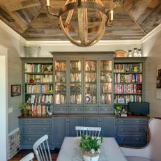 Country Dining Room With Blue Bookshelf