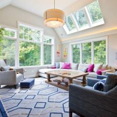 Family Room With Blue Chairs and Fuchsia Sofa Throw Pillows