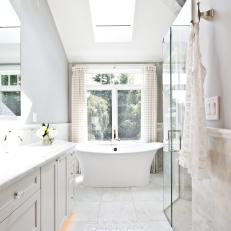 Gray Master Bathroom With Skylight & Freestanding Tub