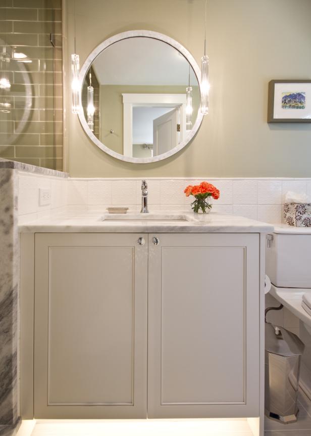 Neutral Guest Bathroom With Single Vanity and Round Mirror HGTV