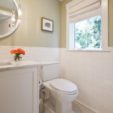 Guest Bathroom With Taupe Walls and White Tile Backsplash
