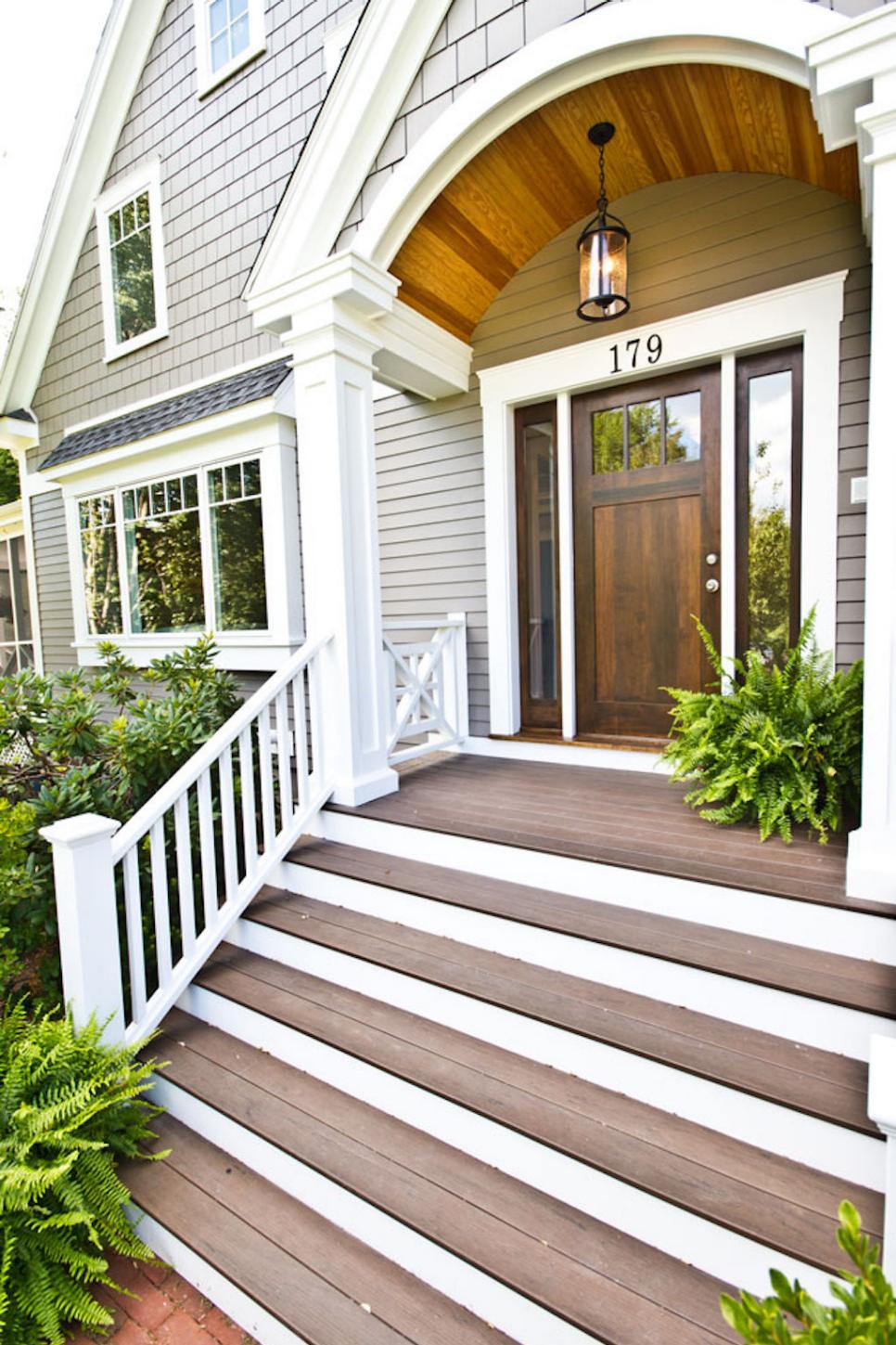 Gray Front Porch With White Trim and Wood-Ceilinged Arch | HGTV