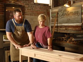 As seen on Home Town, Ben and Erin Napier (C) work on finishing a custom desk in their workshop located in Laurel, MS. (workshop)